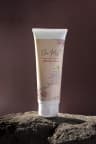 Elanmist Glutathione Cream tube standing on a natural rock